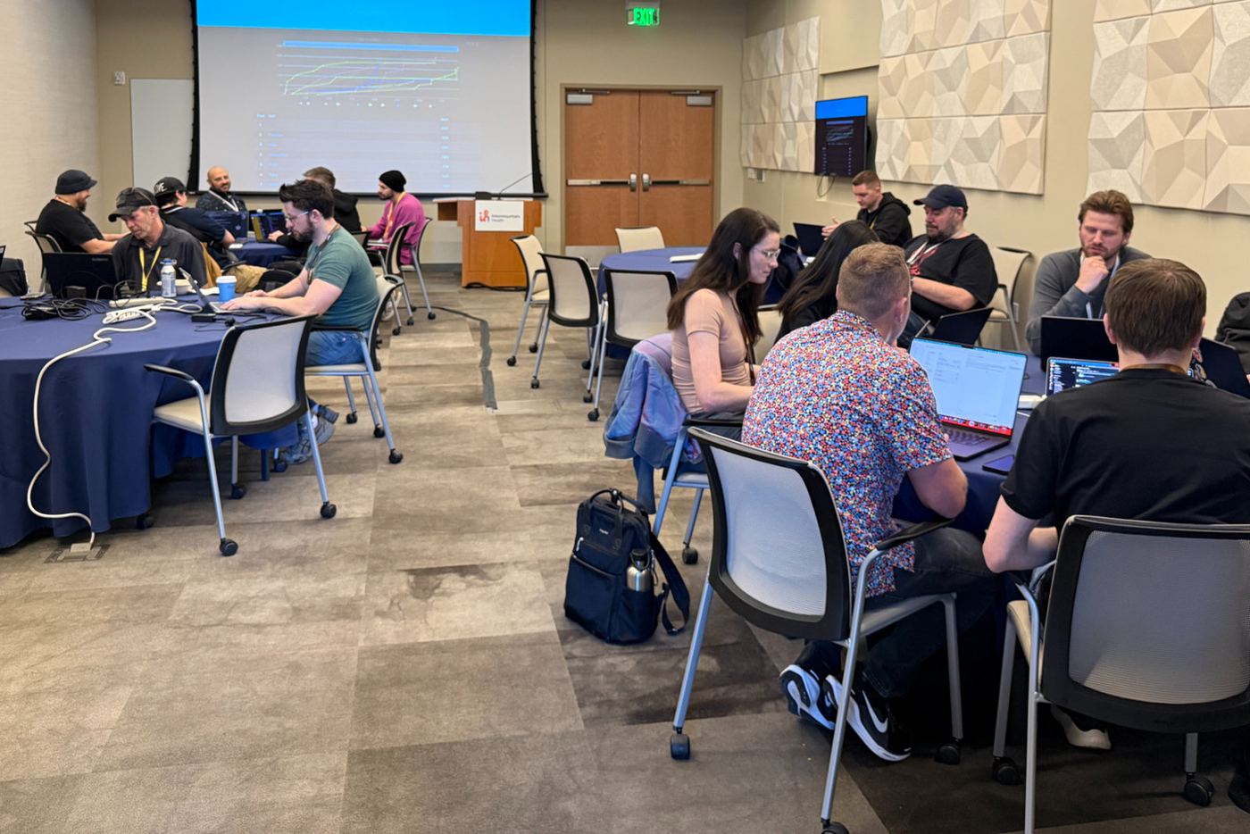 Attendees on laptops during a hands-on workshop